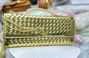 Ladies Woven Leather Clutch Bag With a Signature Knot Closure