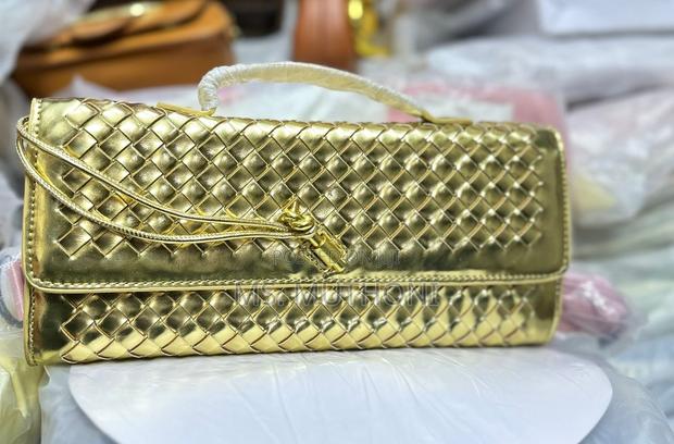 Ladies Woven Leather Clutch Bag With a Signature Knot Closure