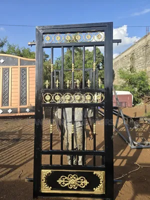 Stylish Black Gold Gate With Side Door