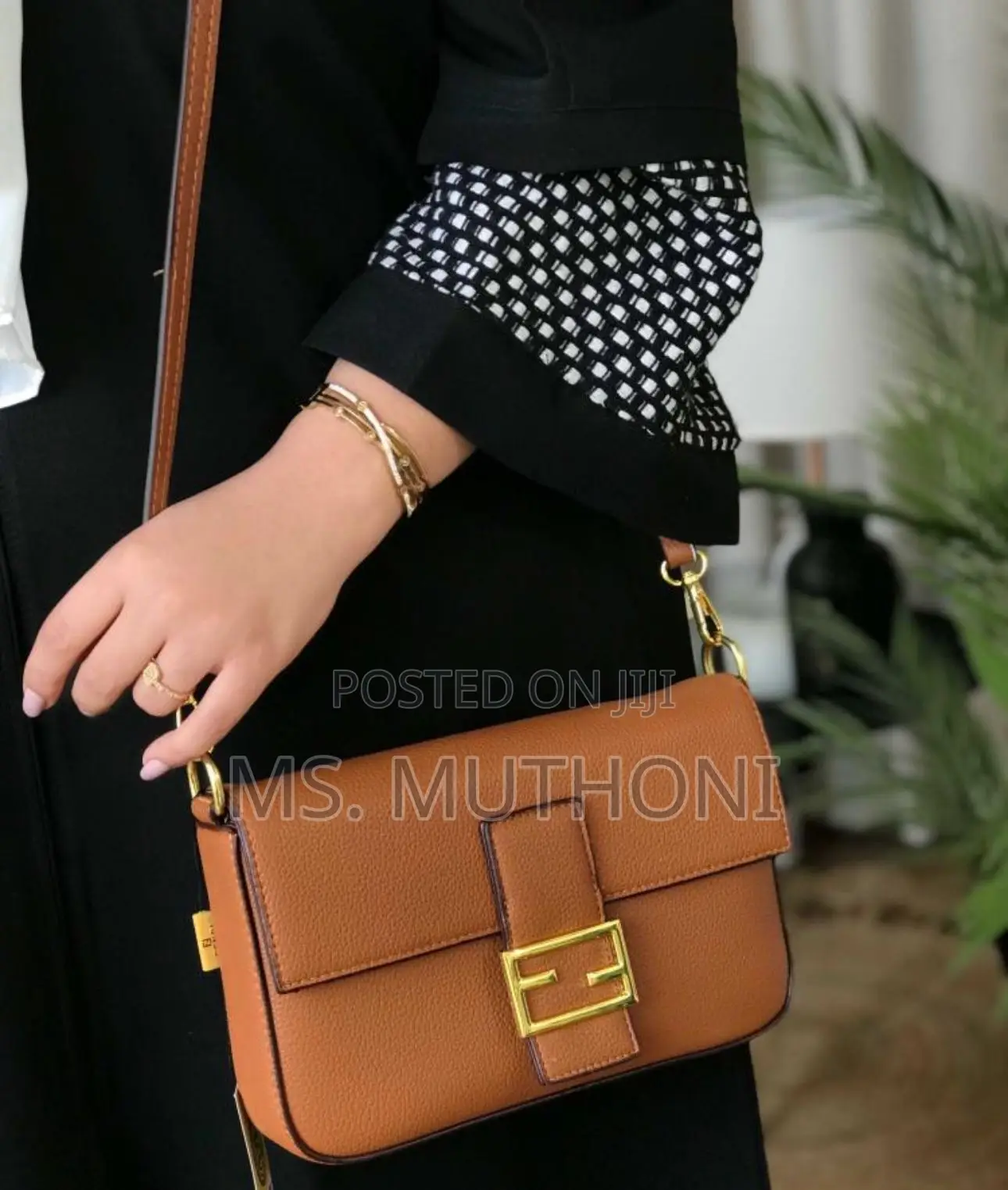 Fendi Medium Baguette Bag With Gold Hardware.