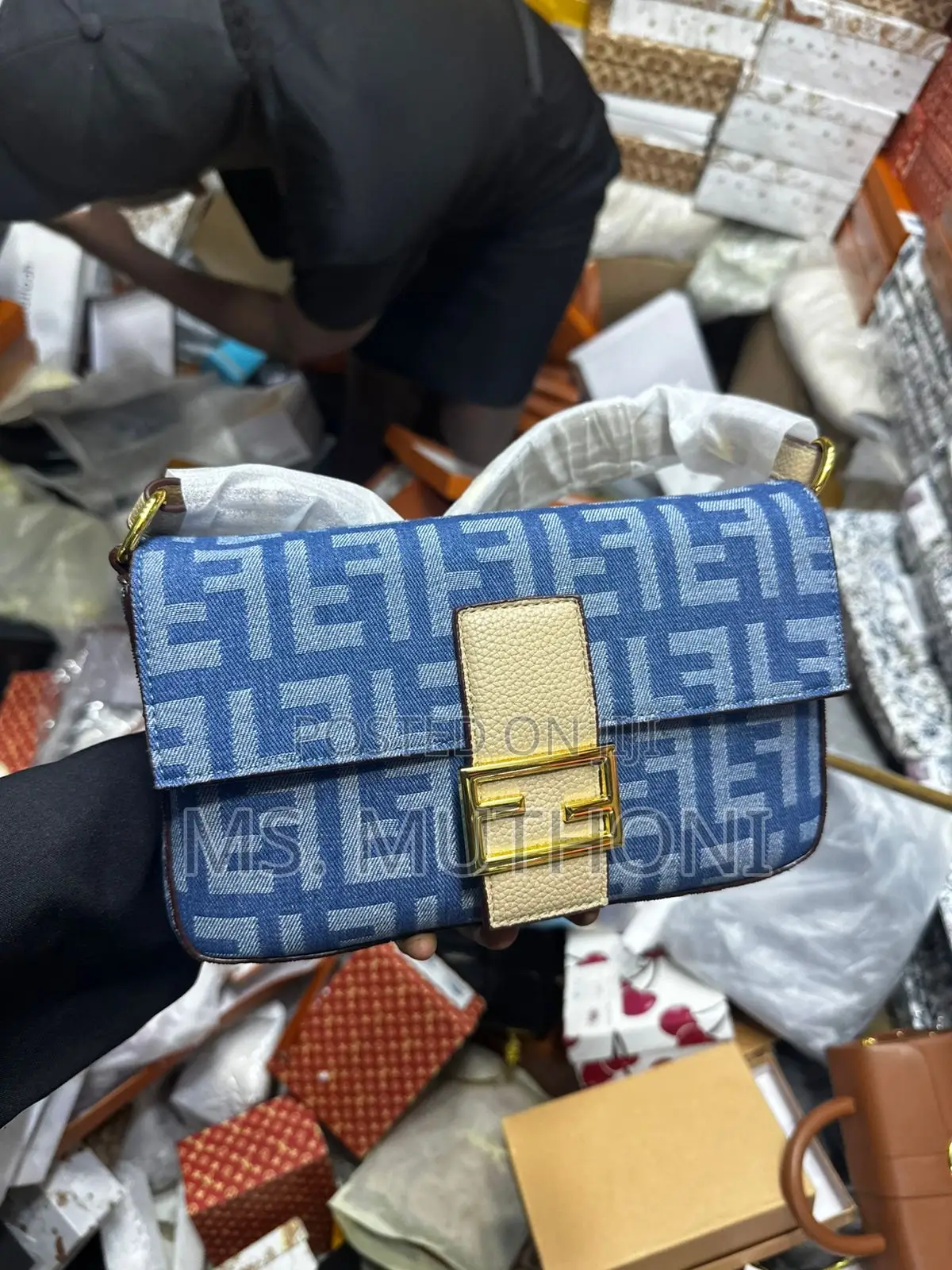 Fendi Medium Baguette Bag With Gold Hardware.