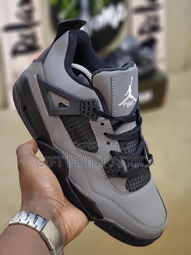 Nike Air Jordan 4 Retro "Cool Grey" Sneakers.