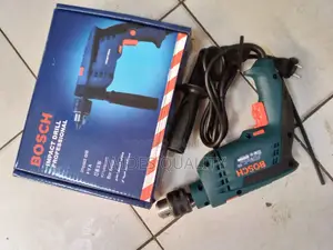 Bosch Drill. Electric Bosch Drill 910 Watts