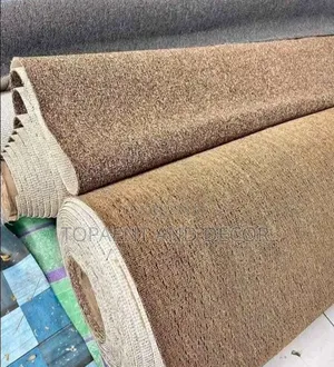 Rolls of Beige Wall to Wall Carpet