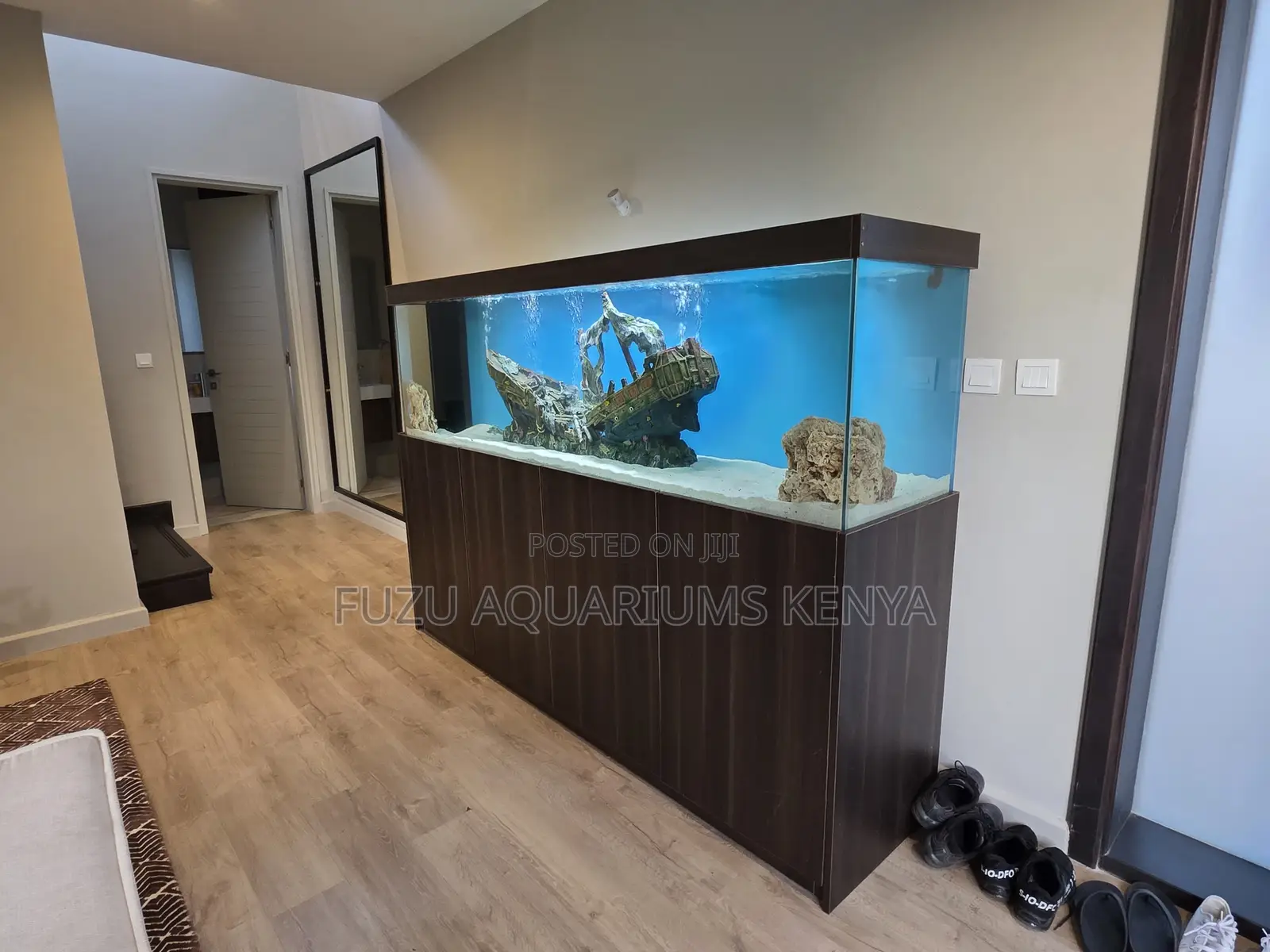 A Full Aquarium Experience With Stylish Cabinet Support