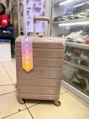 Large Rose Gold Suitcase. Height 63cm