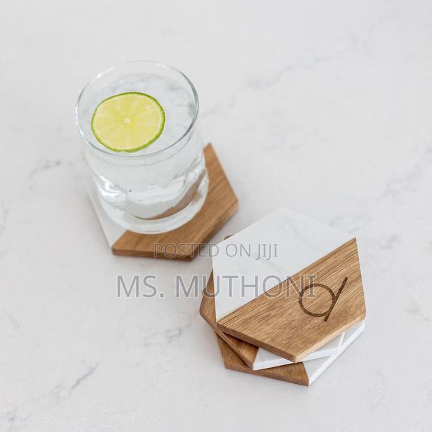 A Set of 6 Hexagonal Coasters Made of White Marble and Acacia *