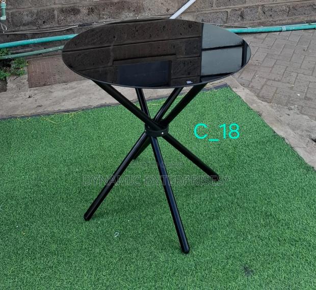 Small Round Black Glass Table With X-Shaped Legs