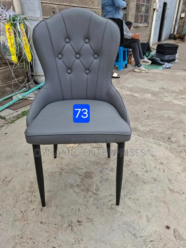 Gray Tufted Dining Chair With Black Legs - main view