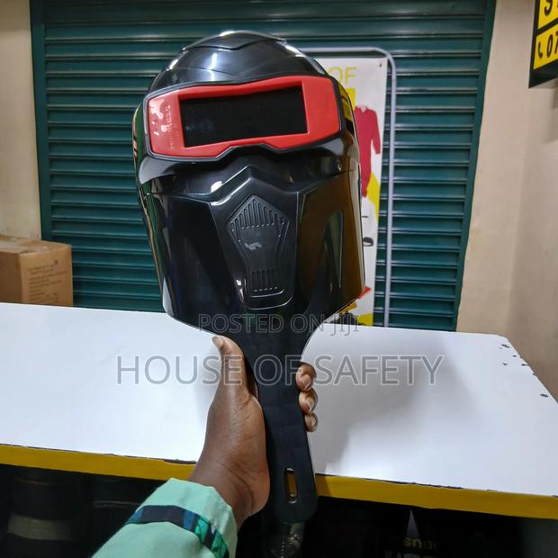 Black Welding Helmet Held By Hand - thumbnail 2