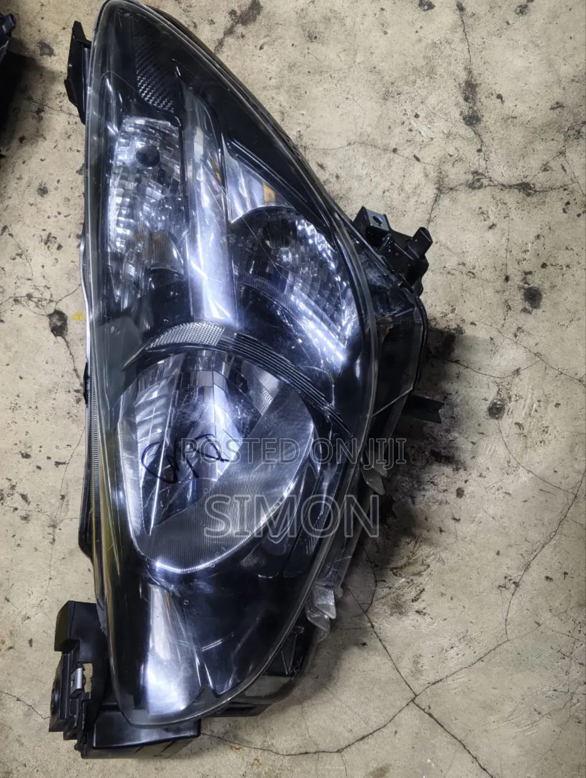 Headlight Mazda Demio 2013