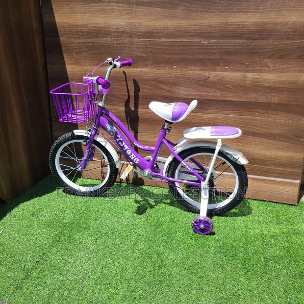 Purple Comet Bicycle With Training Wheels. - main view
