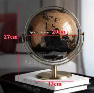 Black and Gold Rotating World Globe With a Metal Stand.