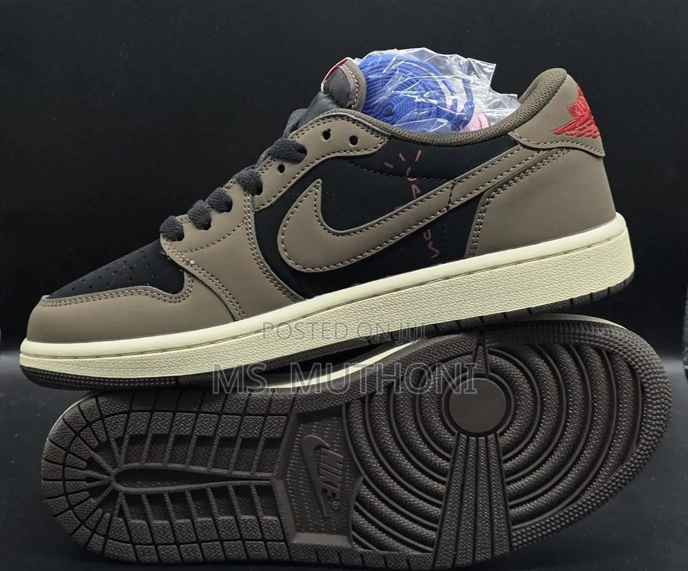 Nike Air Jordan 1 Low Travis Scott in the Dark Mocha Colorway.