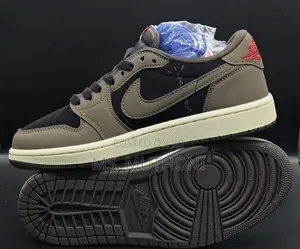 Nike Air Jordan 1 Low Travis Scott in the Dark Mocha Colorway.