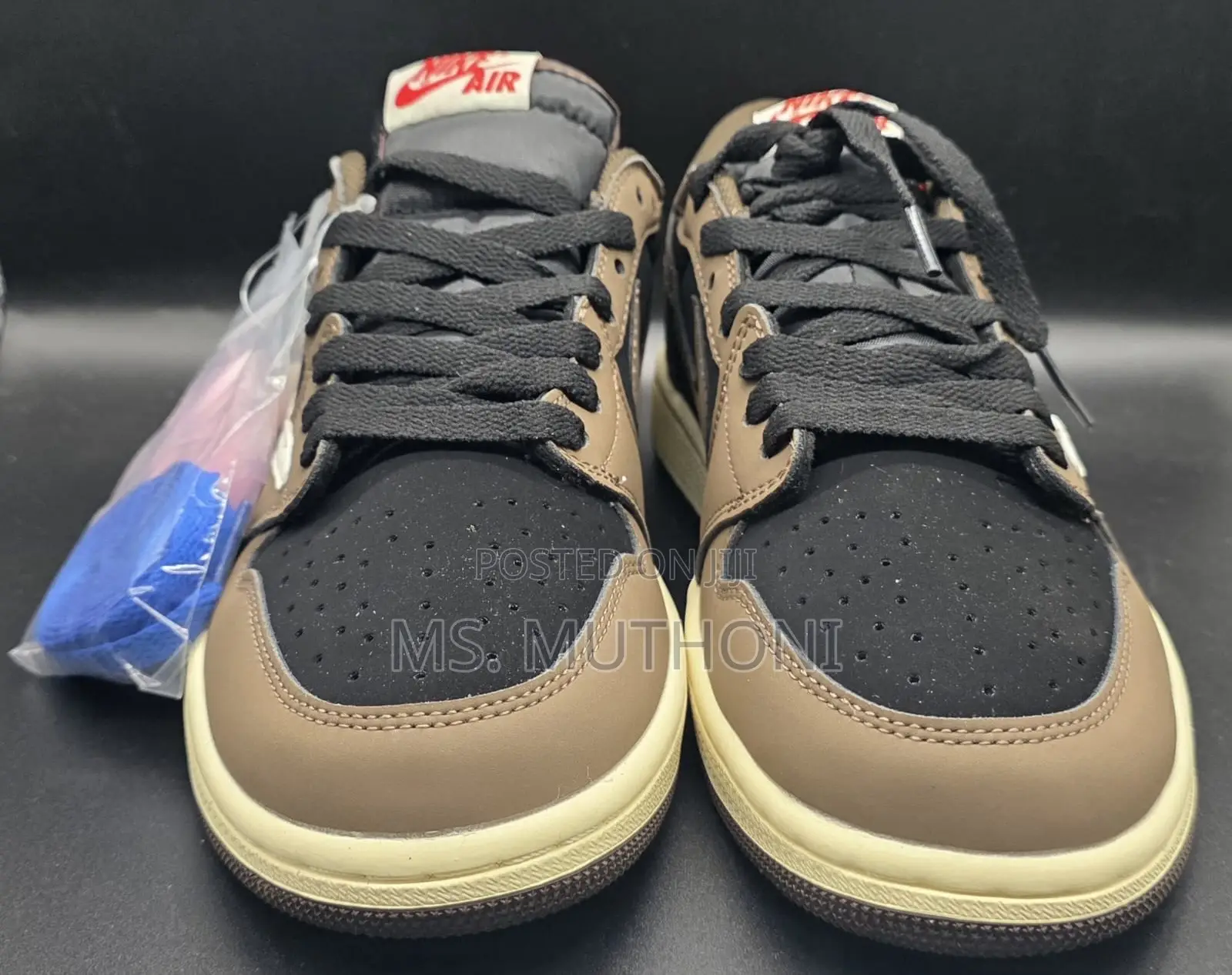 Nike Air Jordan 1 Low Travis Scott in the Dark Mocha Colorway.