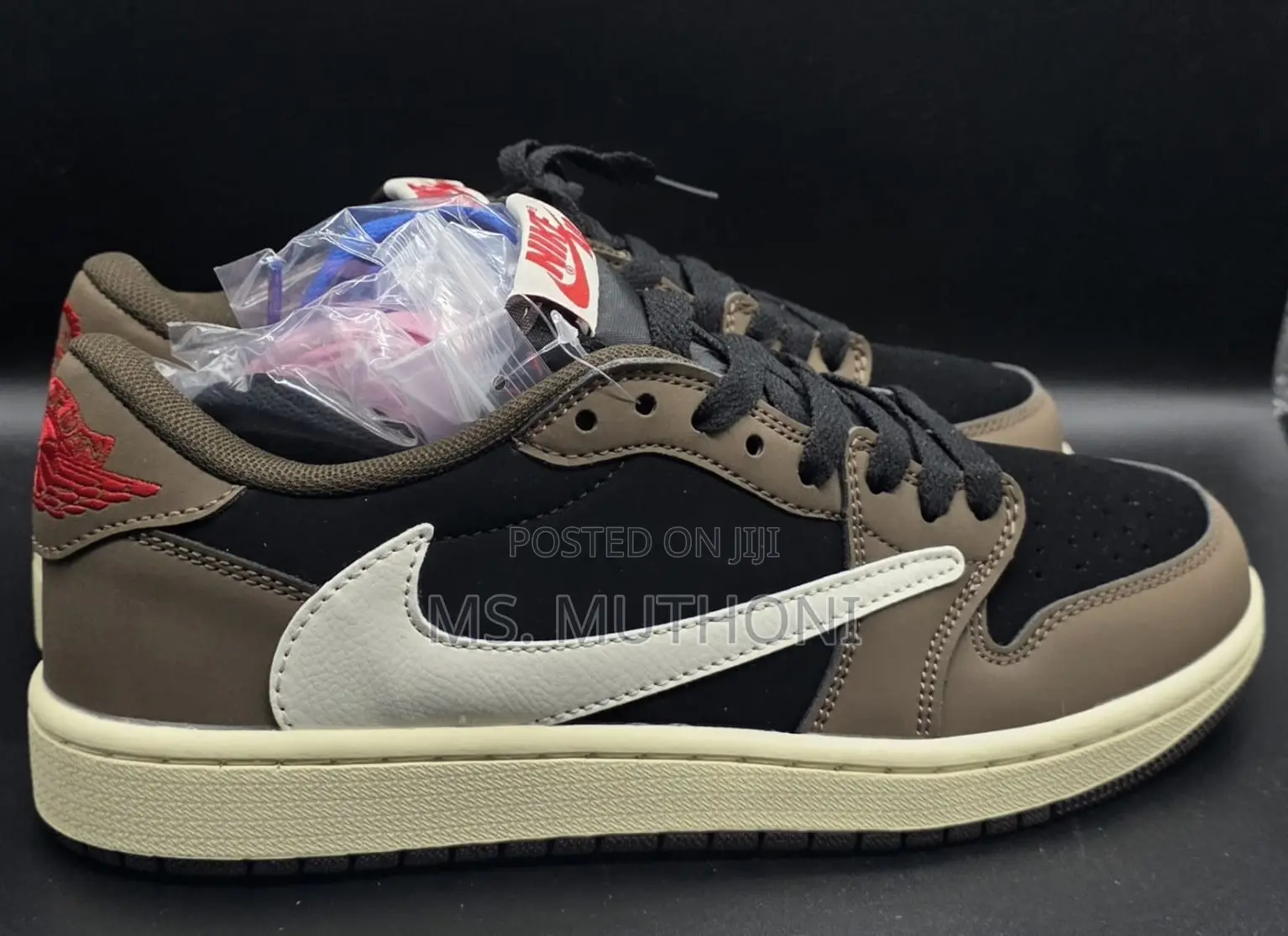 Nike Air Jordan 1 Low Travis Scott in the Dark Mocha Colorway.