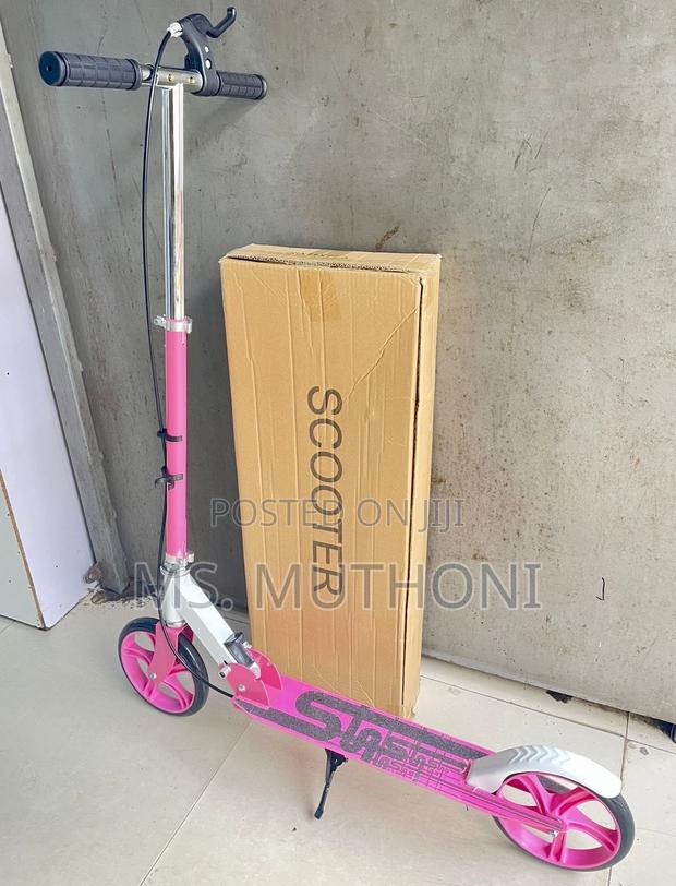 Pink Two-Wheeled Metalic Kick Scooter With Hand Brakes