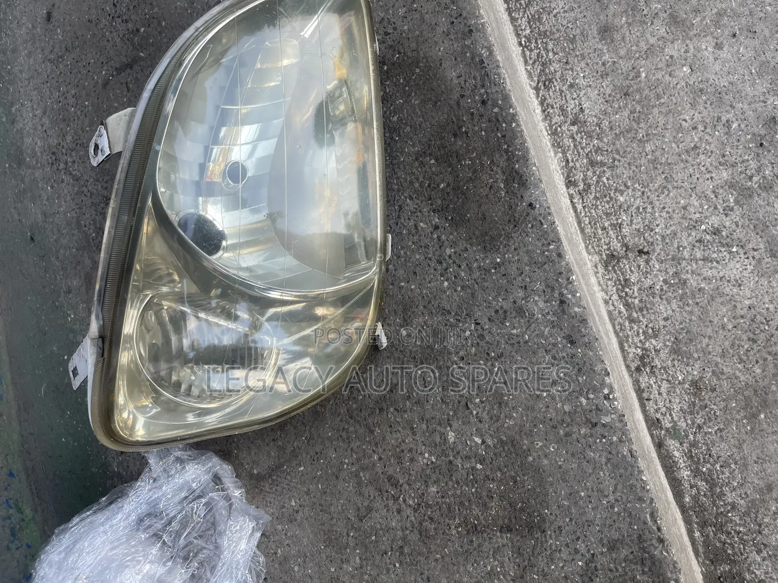 Toyota Raum Headlight