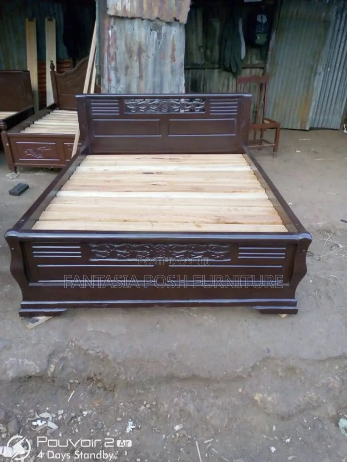 Dark Wood Bed With Carved Panels