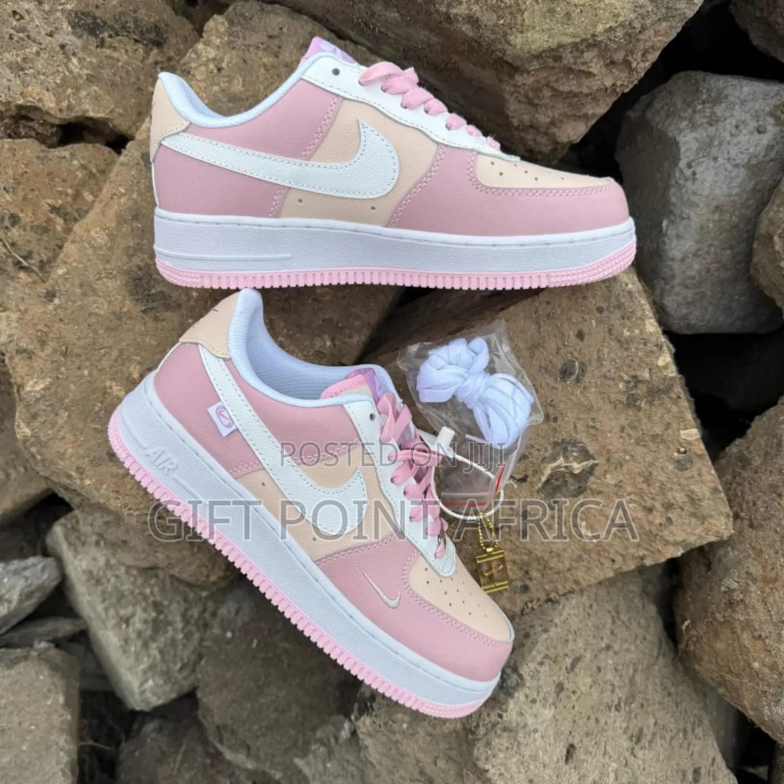 Nike Air Force 1 Low Sneakers In A Pastel Pink And White Colorway.