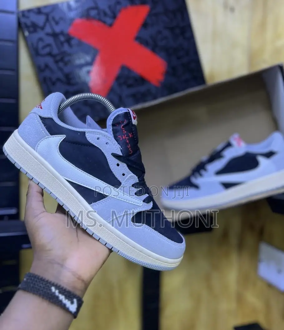 Nike Air Jordan 1 Low Travis Scott in the Dark Mocha Colorway.