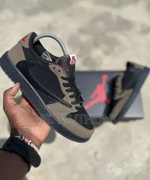 Nike Air Jordan 1 Low Travis Scott in the Dark Mocha Colorway.