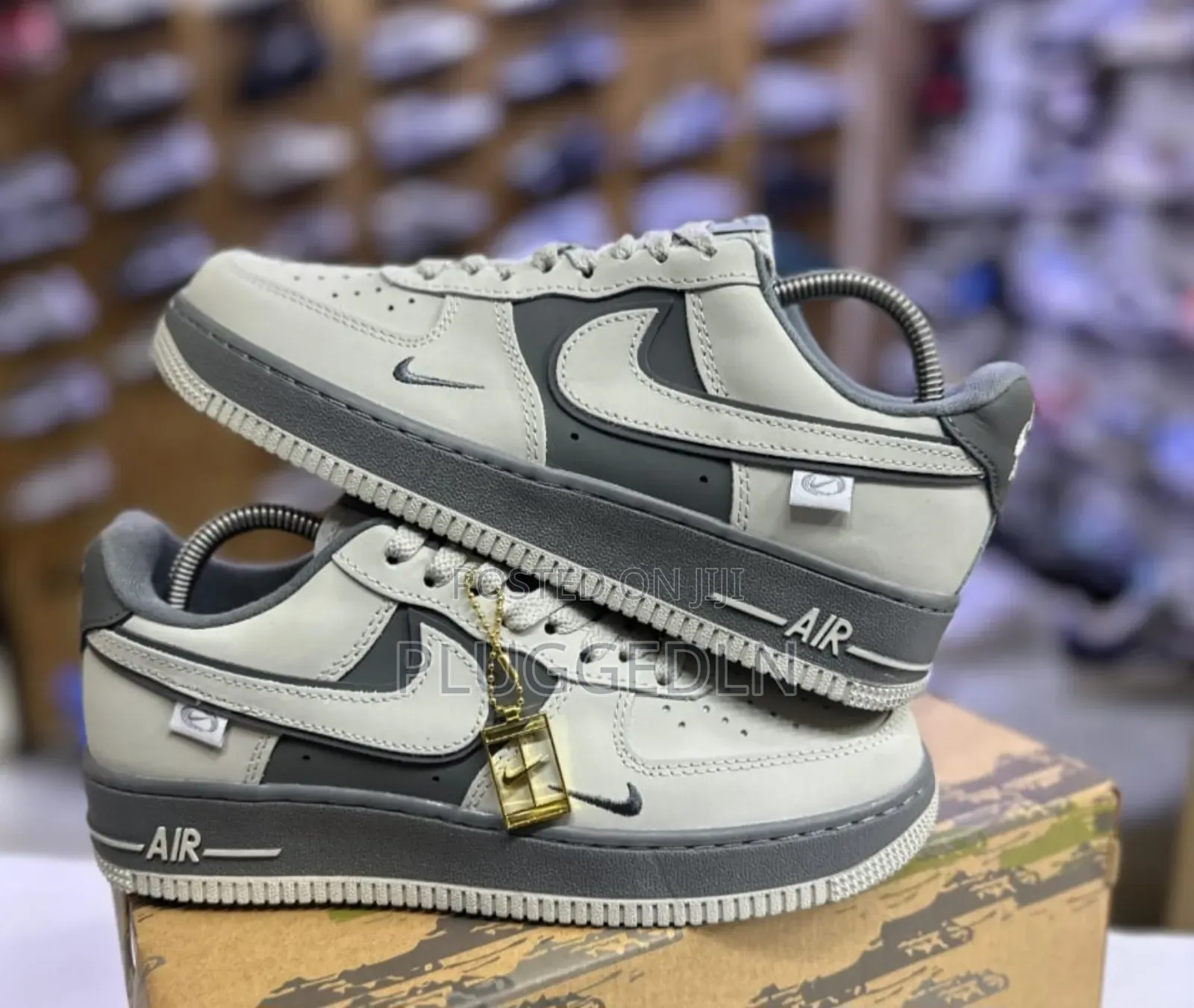 Nike Air Force 1 Low Sneakers in a Grey and Off-White Colorway.