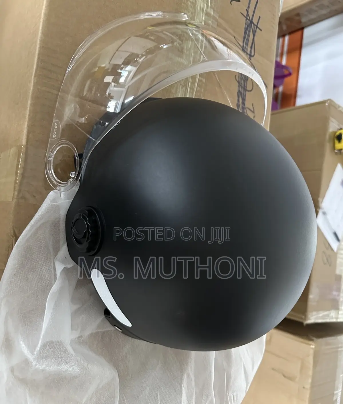 Black Motorcycle Half Helmet With A Clear Visor.