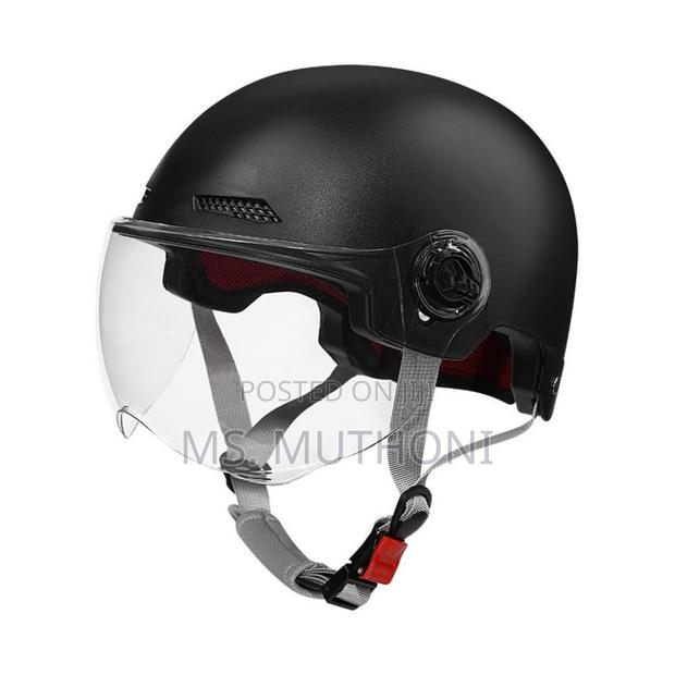 Black Motorcycle Half Helmet With A Clear Visor. - main view