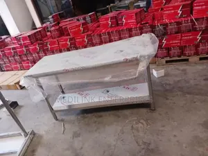 Stainless Steel Commercial Kitchen Working to Tables