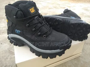 A Brown Caterpillar (Cat) Hiking Or Sports Boots.