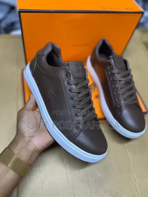 Brown Leather Ravenow Casual Sneakers With White Soles.
