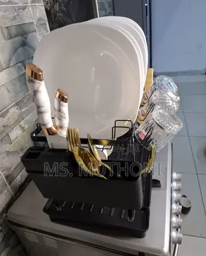 Dish Drying Rack With a Drainboard and Utensil Holder.