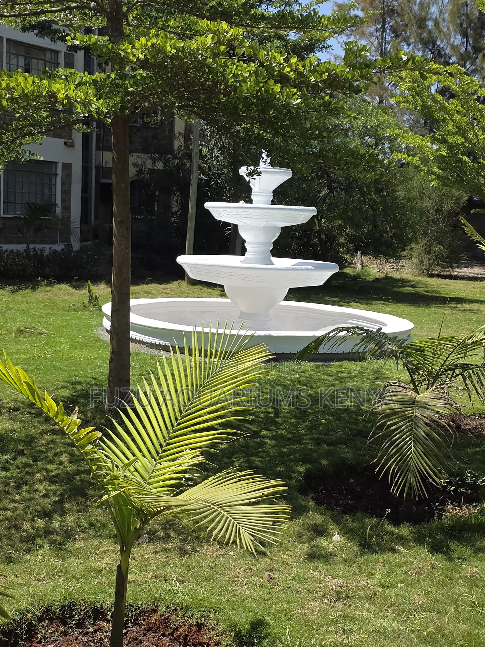 Refined Elegance: Classic White Tiered Water Feature