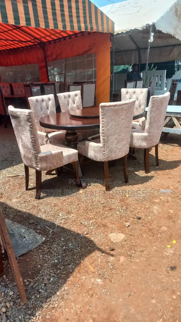 -Seater Oval Revolver Upholstered Dinning Table Set