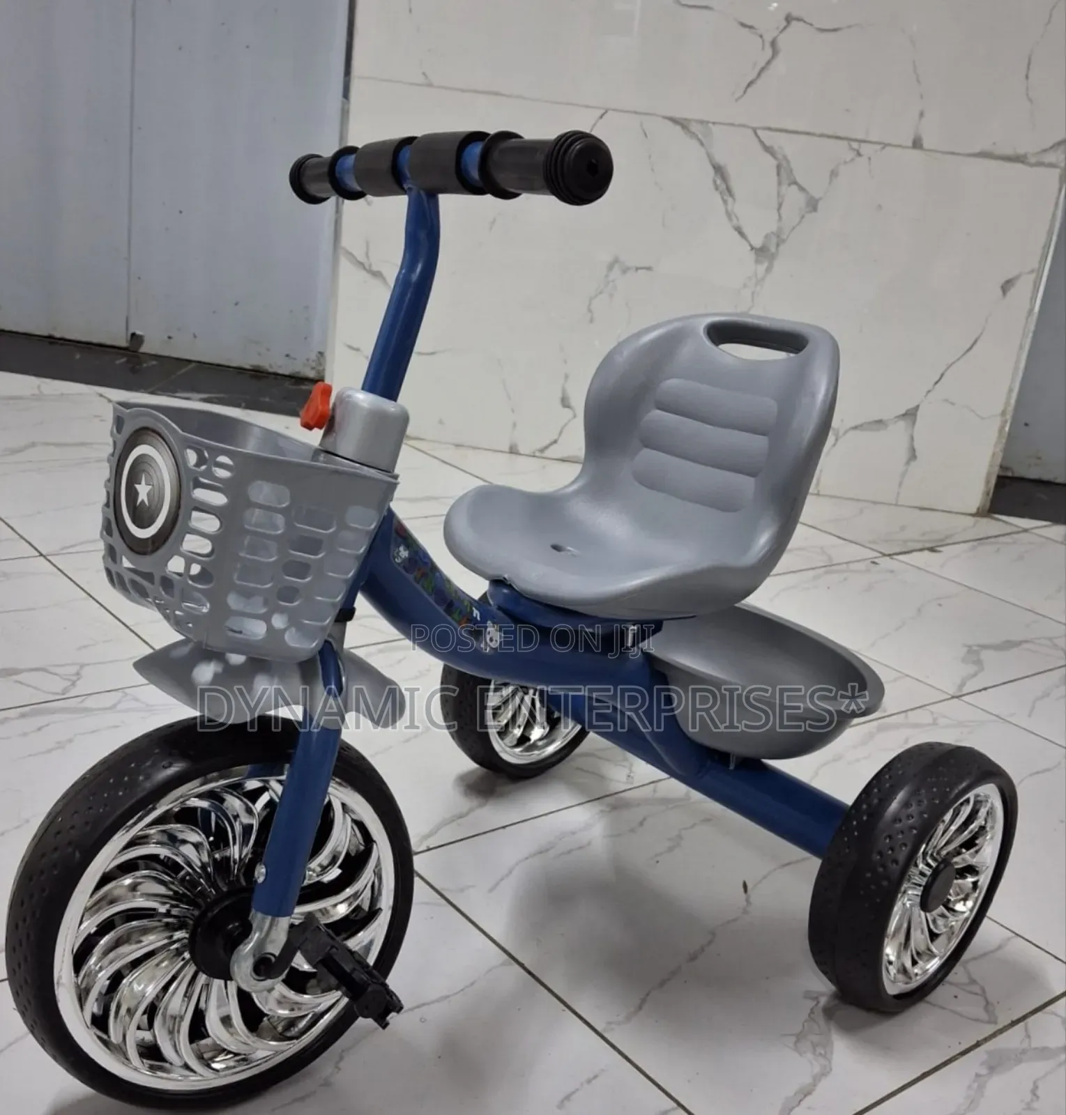 Children's Tricycle With a High Back Seat.