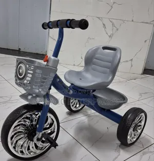 Children's Tricycle With a High Back Seat.