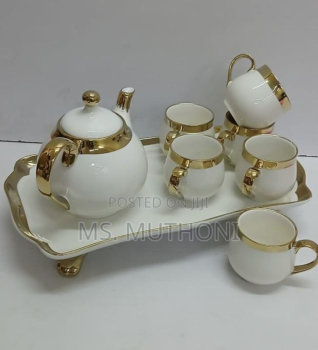 8-Piece Ceramic Tea Set With a White and Gold Finish. - main view