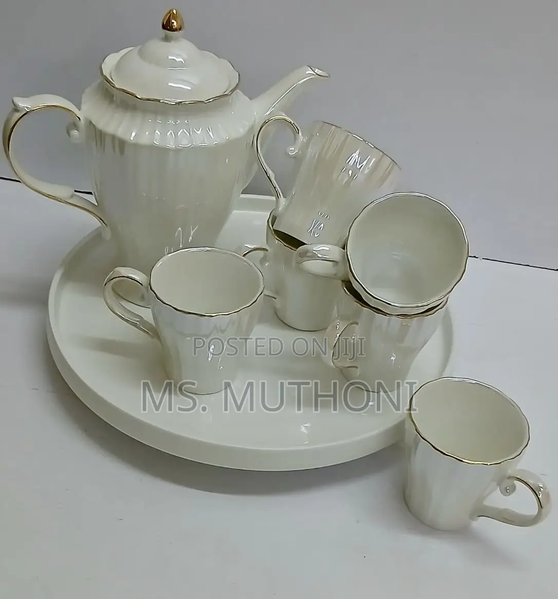 White Porcelain Tea Set With Gold Trim.