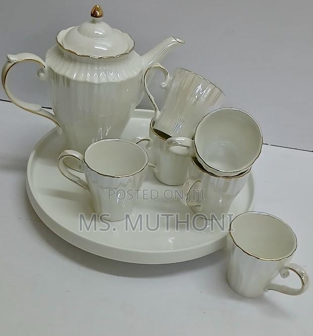 White Porcelain Tea Set With Gold Trim.