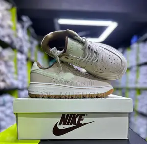 Nike Air Force 1 Luxe Sneakers in a Beige and Mint Green Colorway