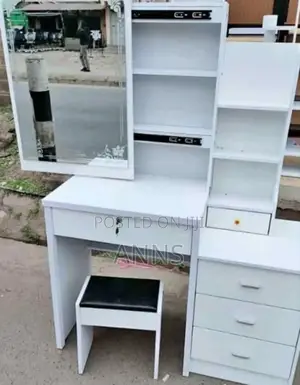 White Dressing Table With a Wide Sliding Mirror