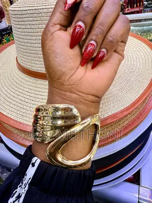 Ladies Statement Wide, Gold-Tone Metal Cuff Bangles.
