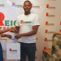 REIGNS PROPERTIES logo