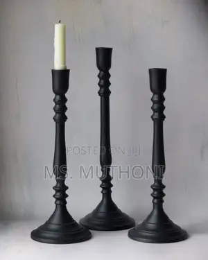 Set of Three Matte Black Metal Taper Candle Holders With Gold Accents