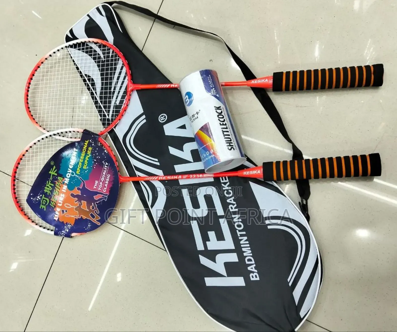 A Pair Of Badminton Rackets With Three Shuttles Cocks And Carrier Bag