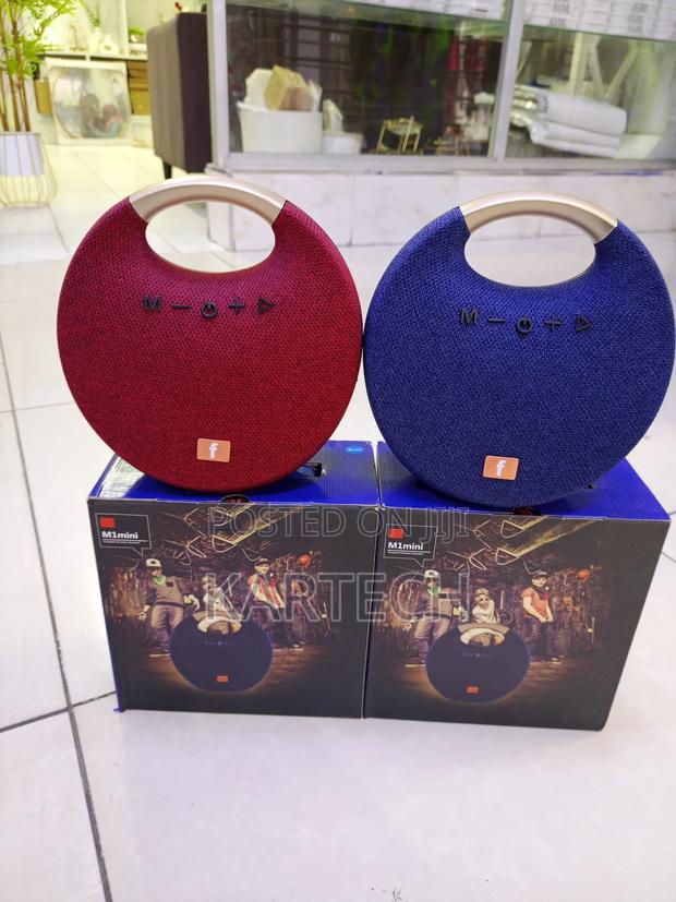 M1 Mini Portable Bluetooth Speaker – Powerful Bass, Handle Design