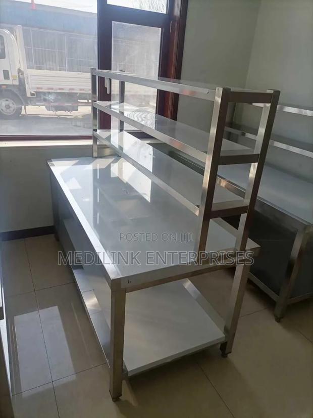 Commercial Kitchen Working Table Customized With a Service Rack