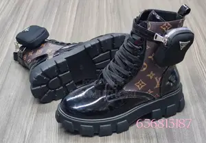 Black Patent Leather Prada Monolith Boots With a Detachable Pouch.